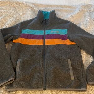 Cotopaxi Gray Jacket with Teal, Purple, and Orange Accents